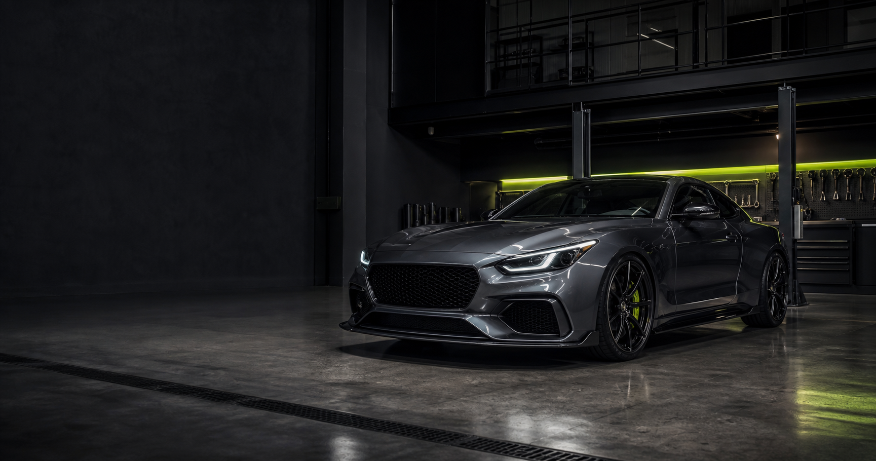 Graphite performance coupe inside a specialist workshop